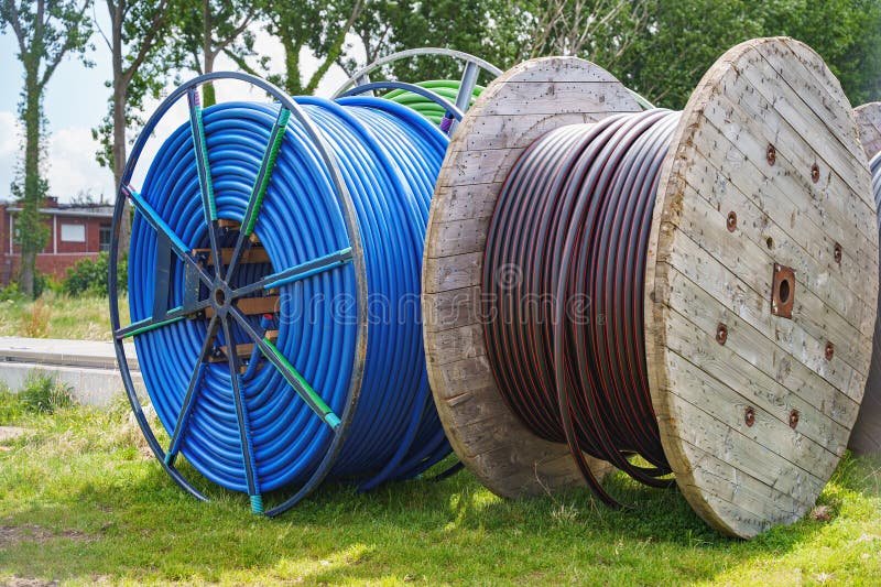 Industrial cable reels stored outdoors at a construction project