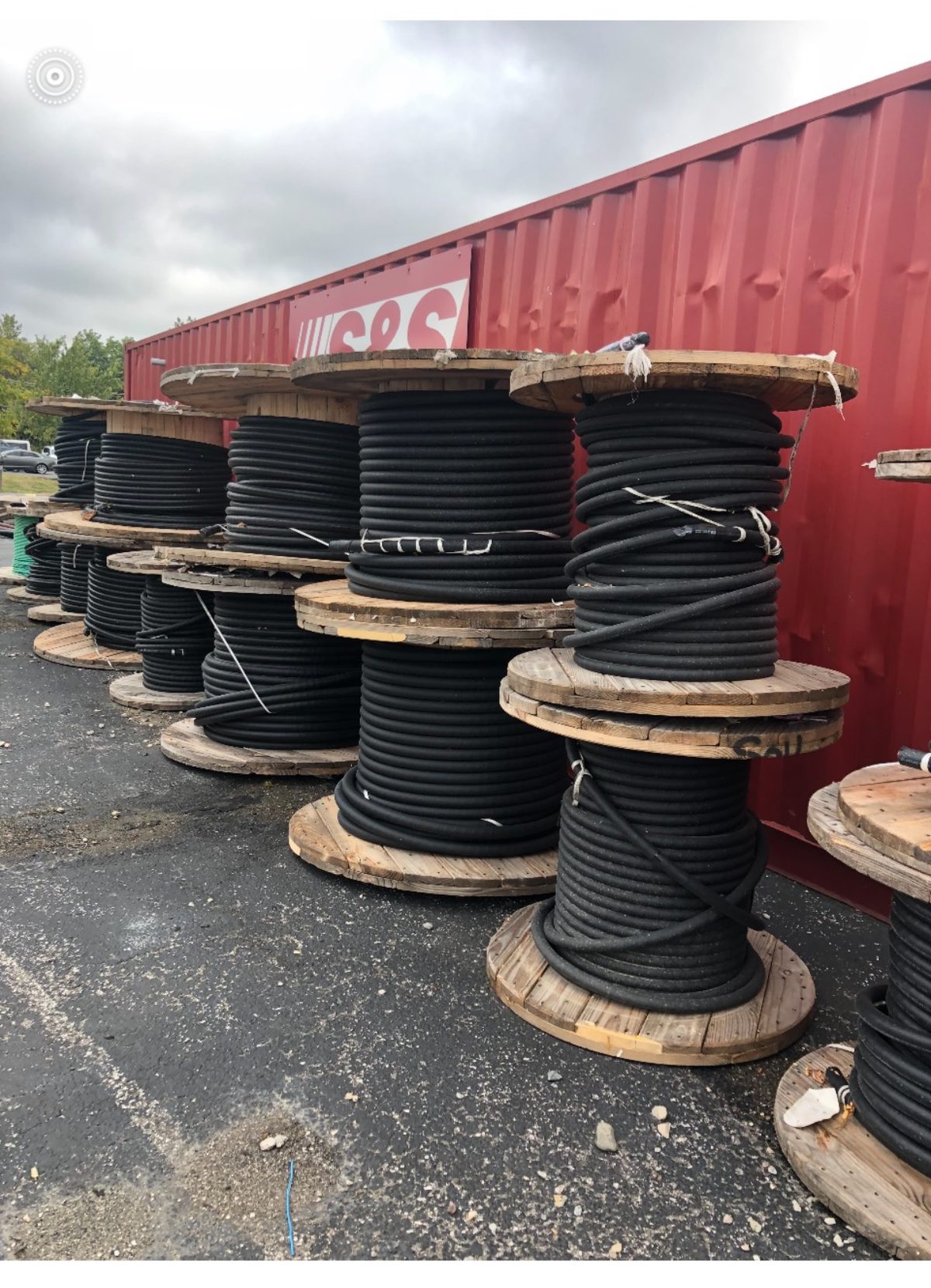 Stacked spools of surplus electrical cable purchased from a contractor